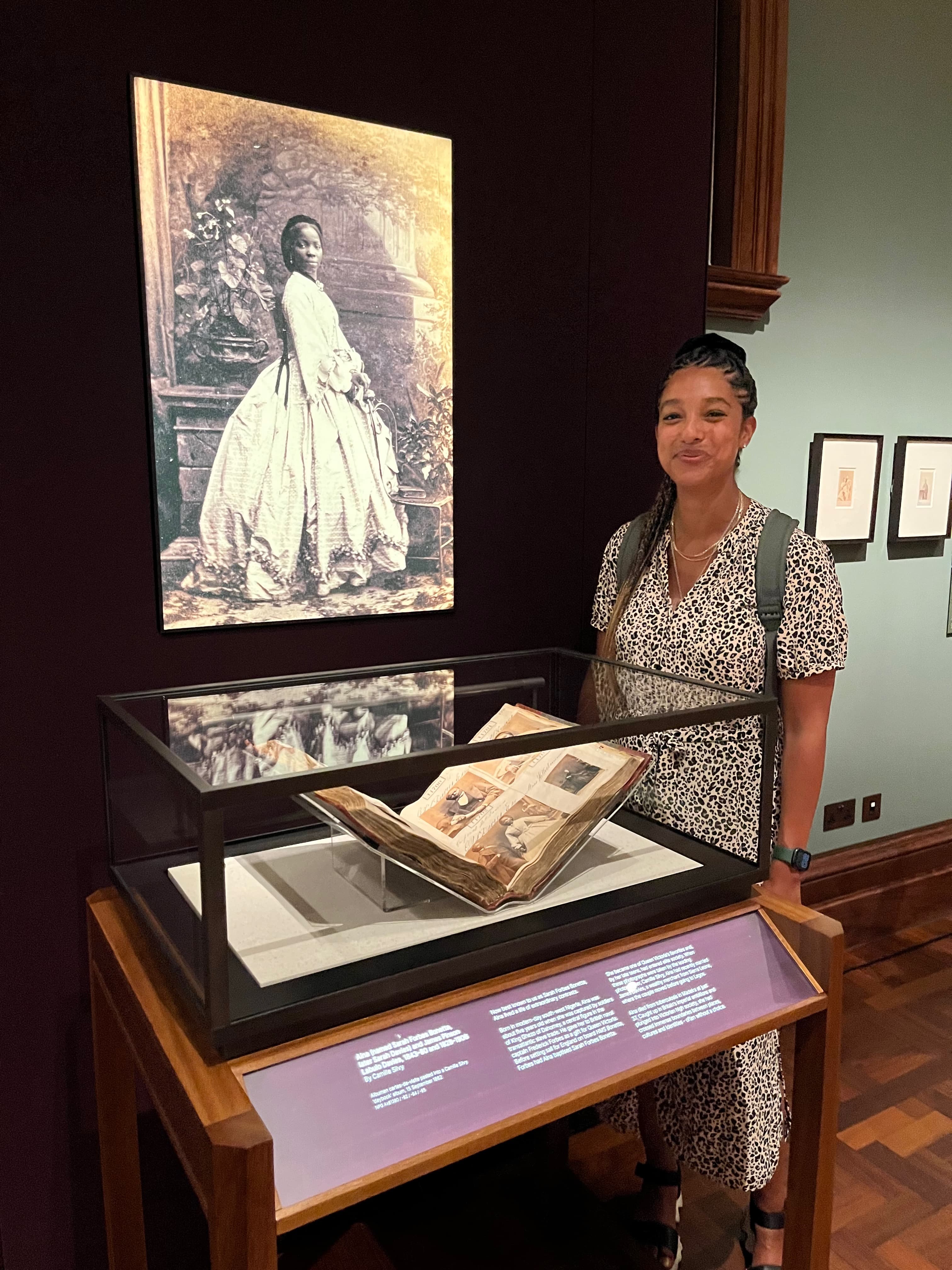 Hannah standing next to display about Aina Forbes Bonetta